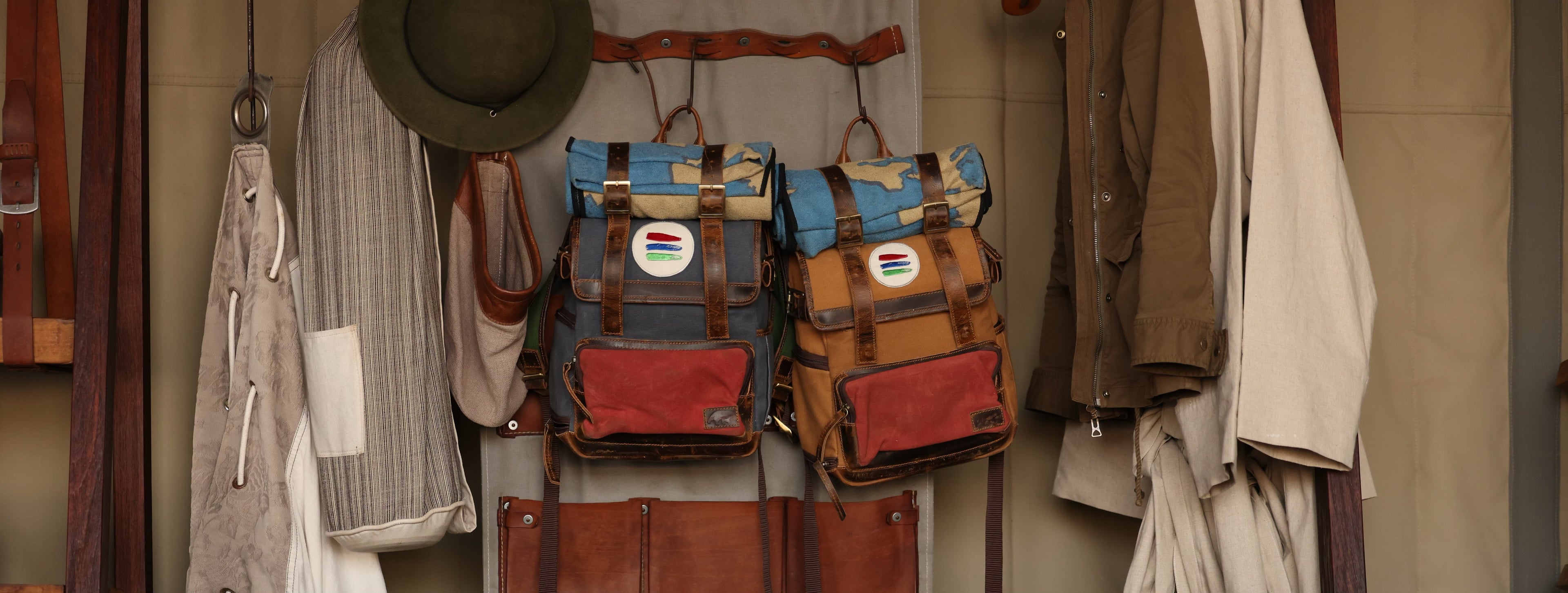 Photo of a collection of safari gear hanging inside of a tent.