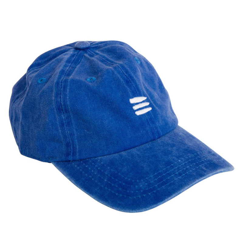 Product photo with a white background of a blue baseball cap with a white embroidered bucket list logo on the front of the cap.