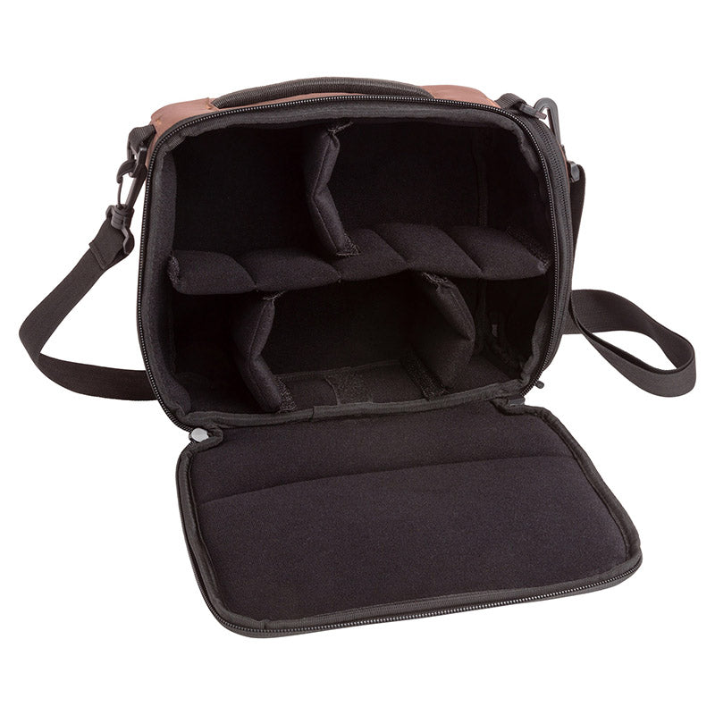 Product photo of a brown camera cube bag with the front dipper opening open on a white table with a white background. The inside is black and is divided into five sections.
