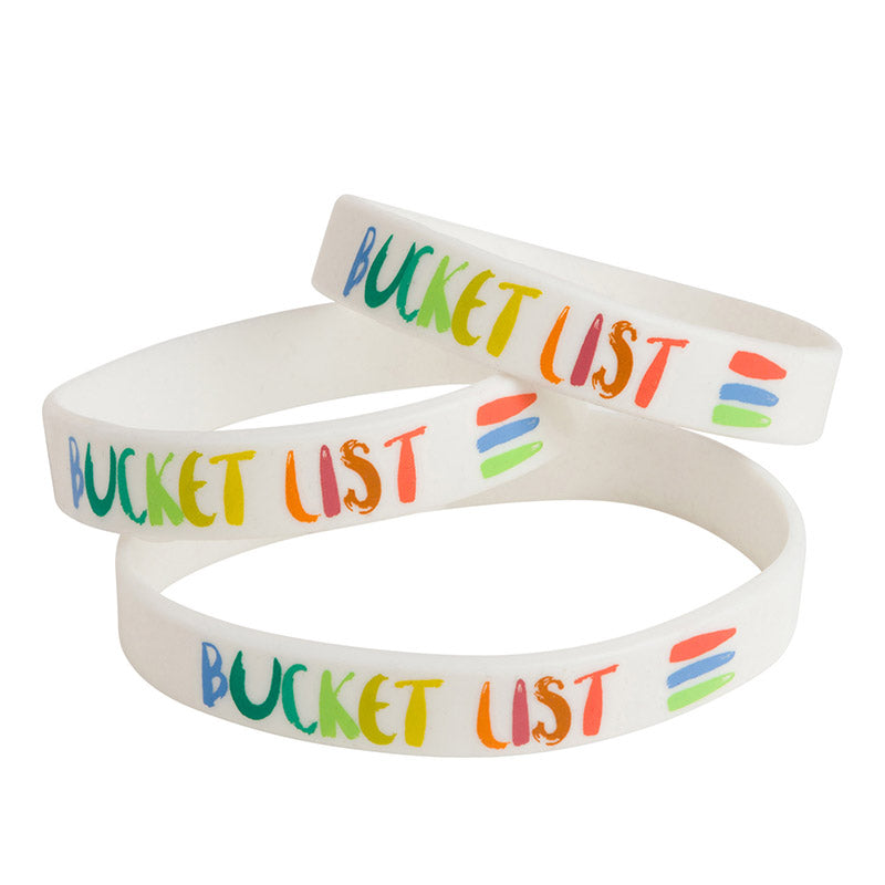 Product photo of three rubber bracelets that say bucket list on them with the bucket list logo next to it.
