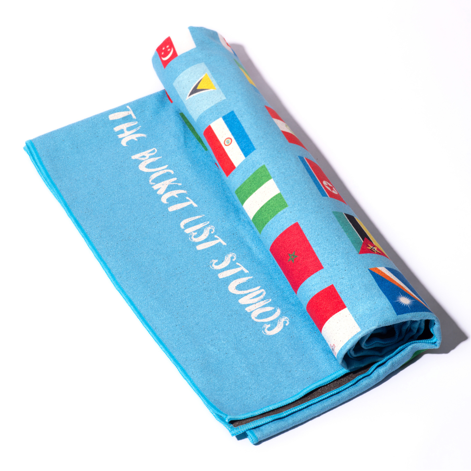 Product photo of the blue Flags of the World Blanket rolled up with white background.