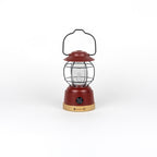 Red lantern with a black handle on a white background