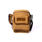 Product photo of a tan sling pouch with a white background.