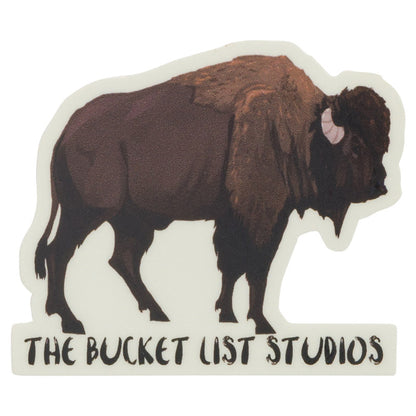 An image of a cartoon bison sticker that says The Bucket List Studios at the bottom. 