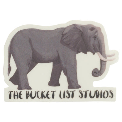 An image of a cartoon elephant sticker that says The Bucket List Studios at the bottom. 