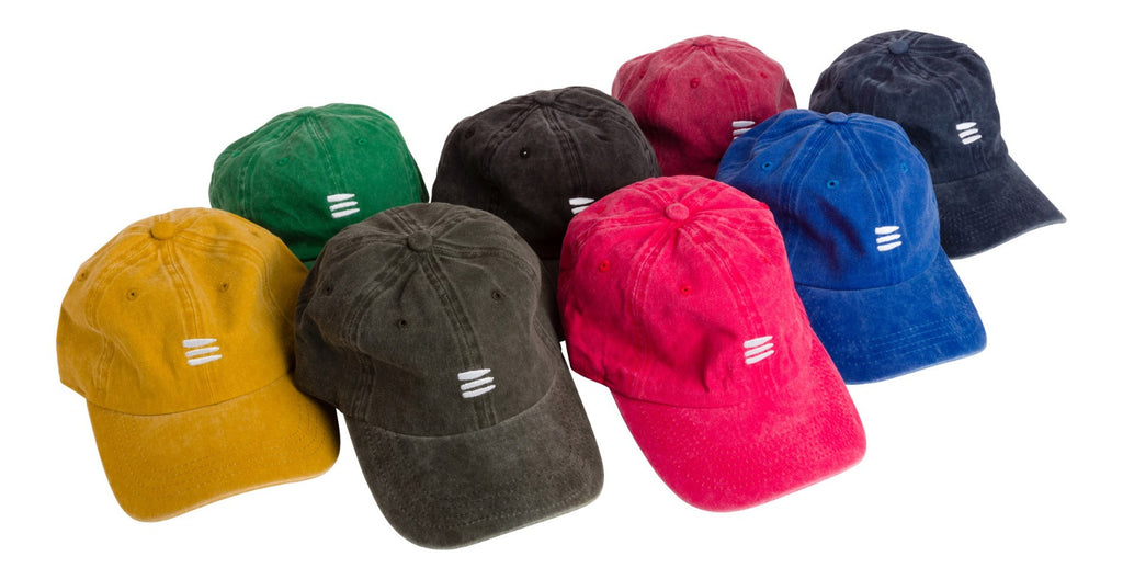 Group product photo of several baseball caps with the bucket list logo embroidered in white on the front of the caps.