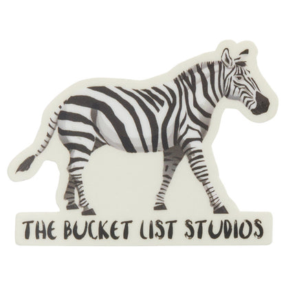 An image of a cartoon zebra sticker that says The Bucket List Studios at the bottom. 