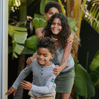 Photo of 3 kids dancing in a line wearing Bucket List apparel.
